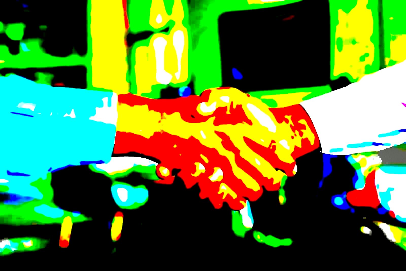 Business handshake representing a corporate acquisition agreement