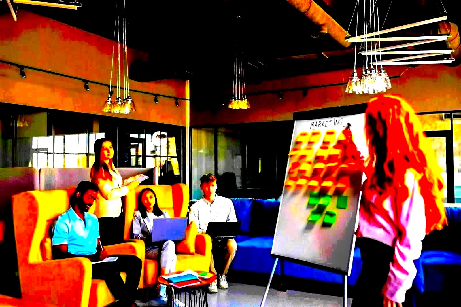 Marketing strategy session with people gathered around a planning whiteboard