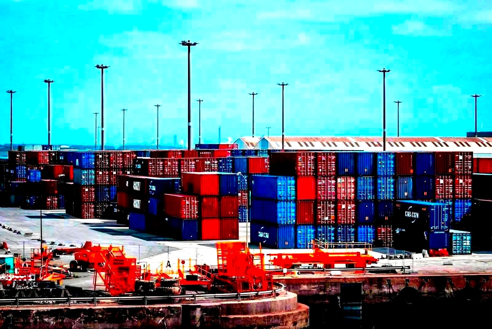 Container ships at a commercial port loaded with cargo containers