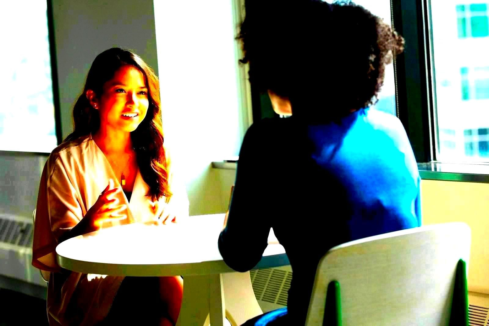 Two professionals in a mentorship conversation