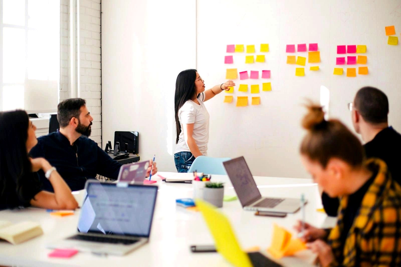 Employees attending a corporate training session in a conference room