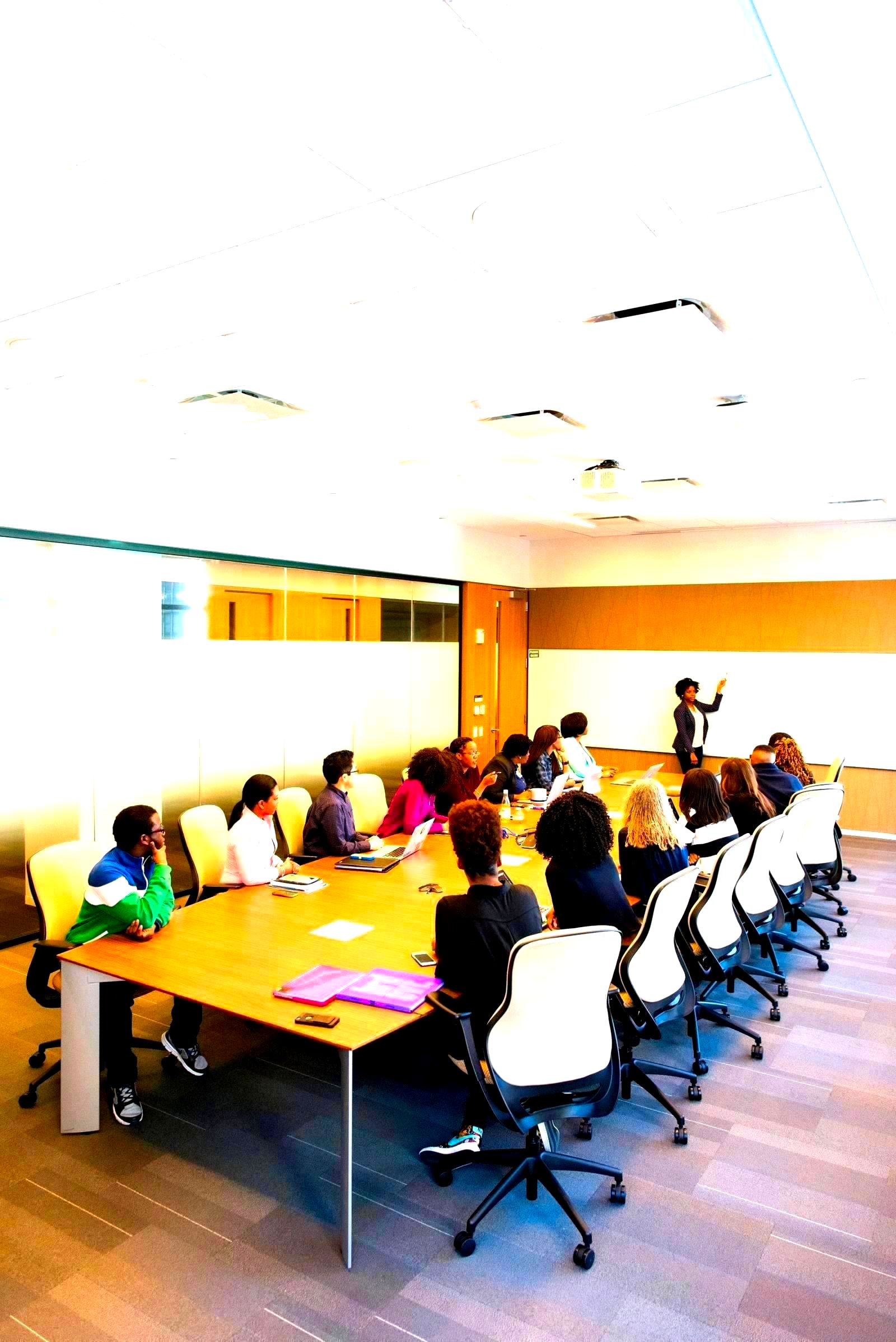 Business professionals meeting inside a corporate conference room