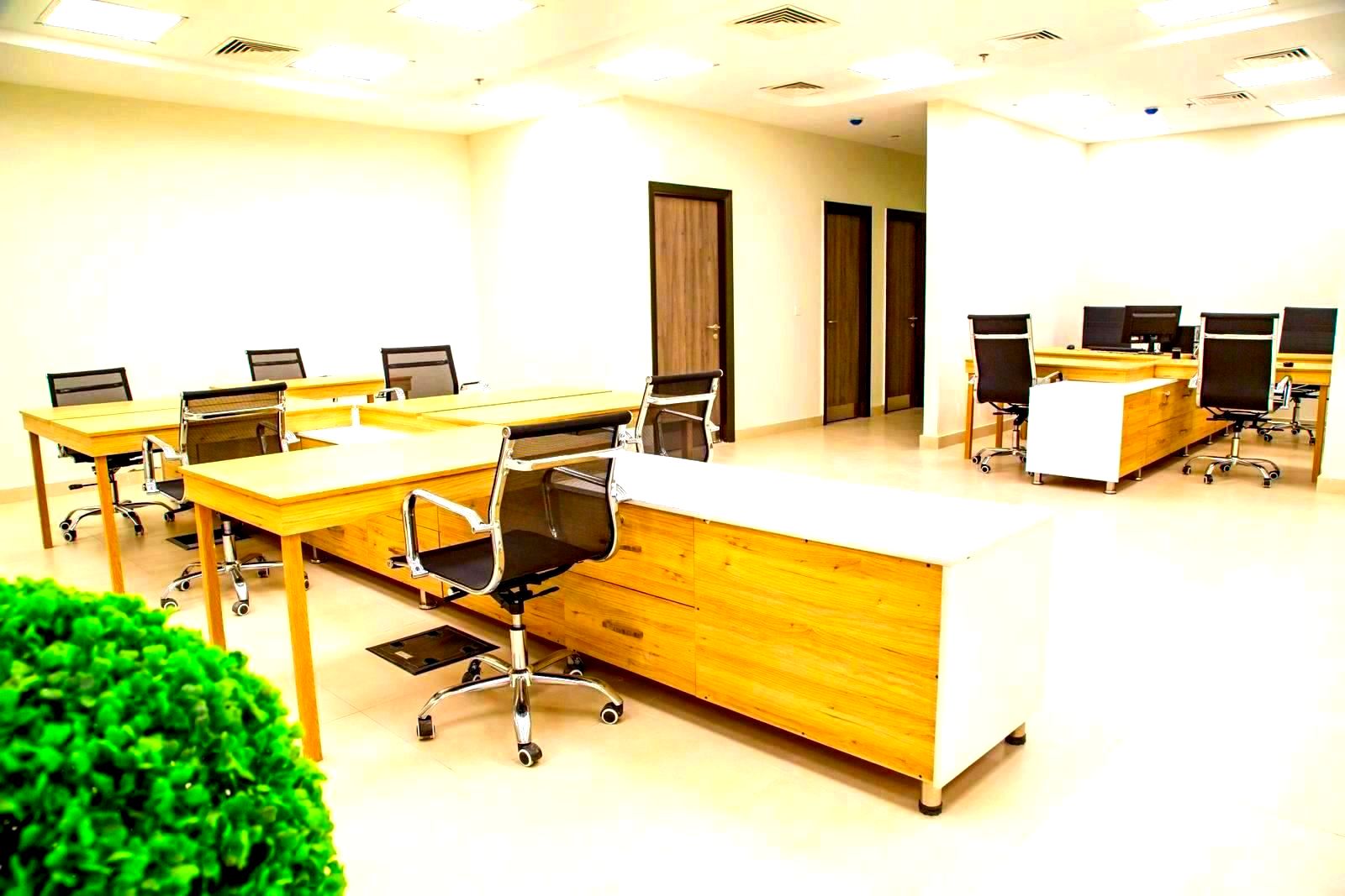 Aerial view of a large open-plan tech company office with desks and workstations