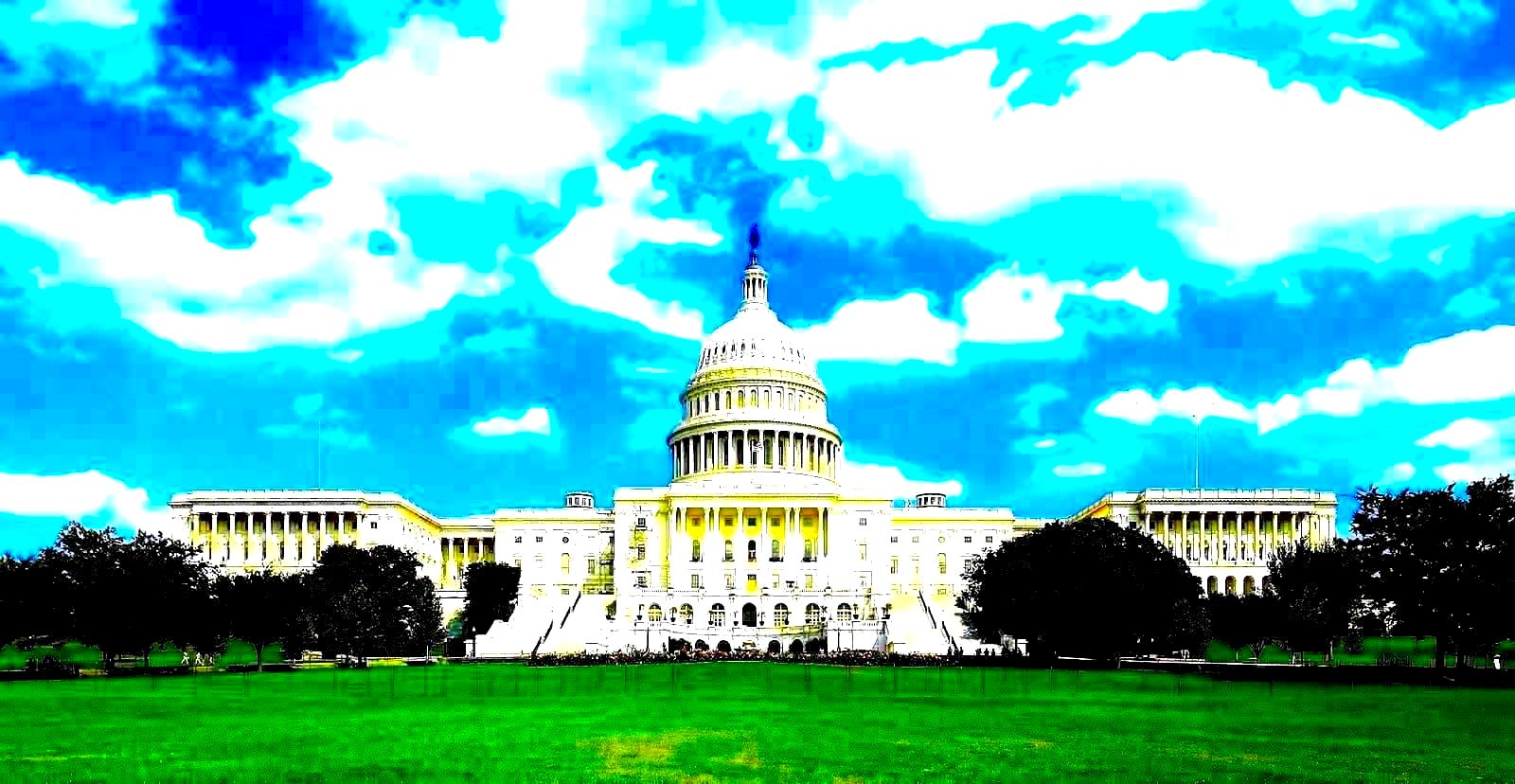 US Capitol building exterior at night with floodlit dome