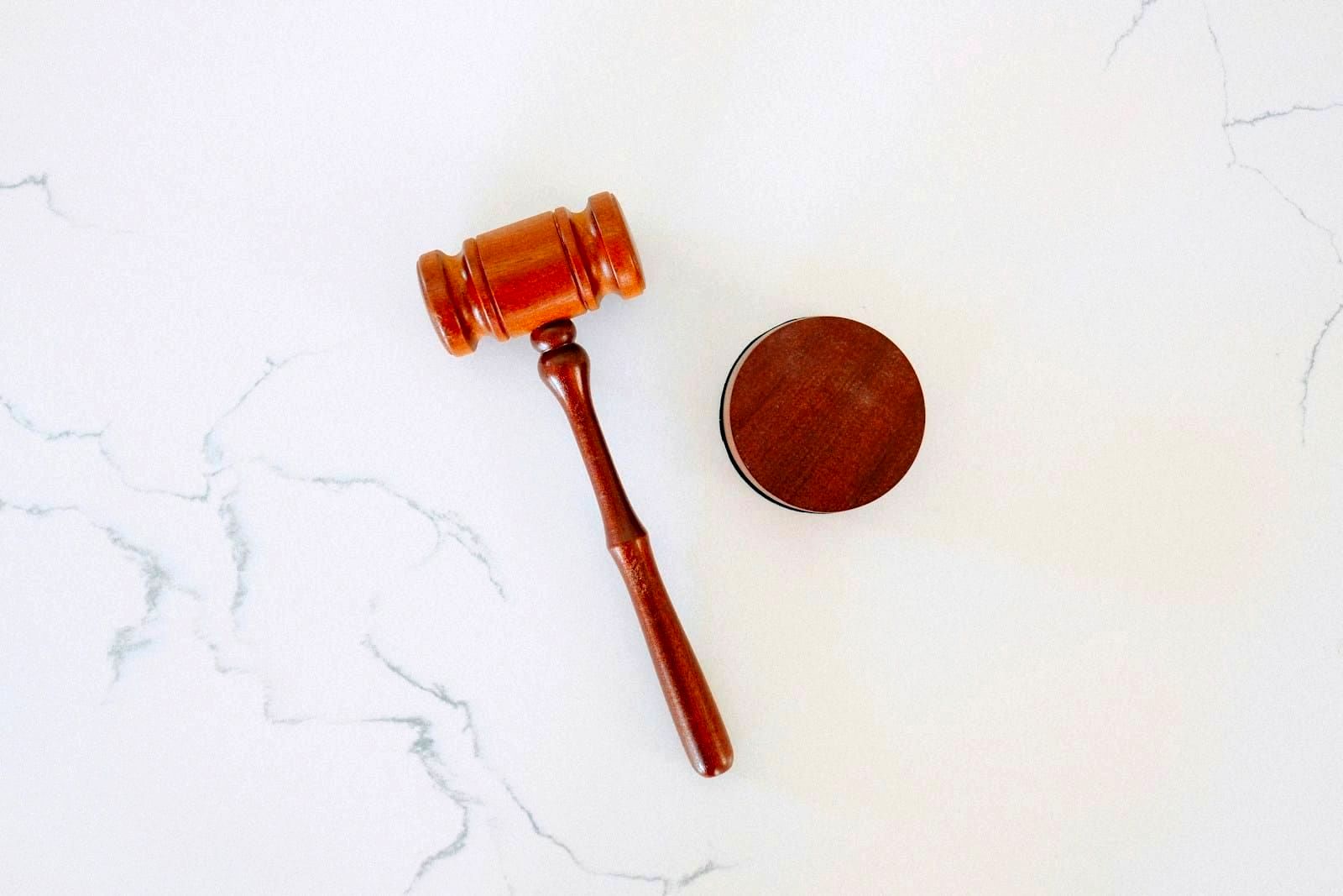 Legal documents and contracts on a desk representing regulatory compliance requirements